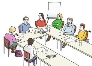 Eine Gruppe Menschen sitzt an einem Konferenztisch